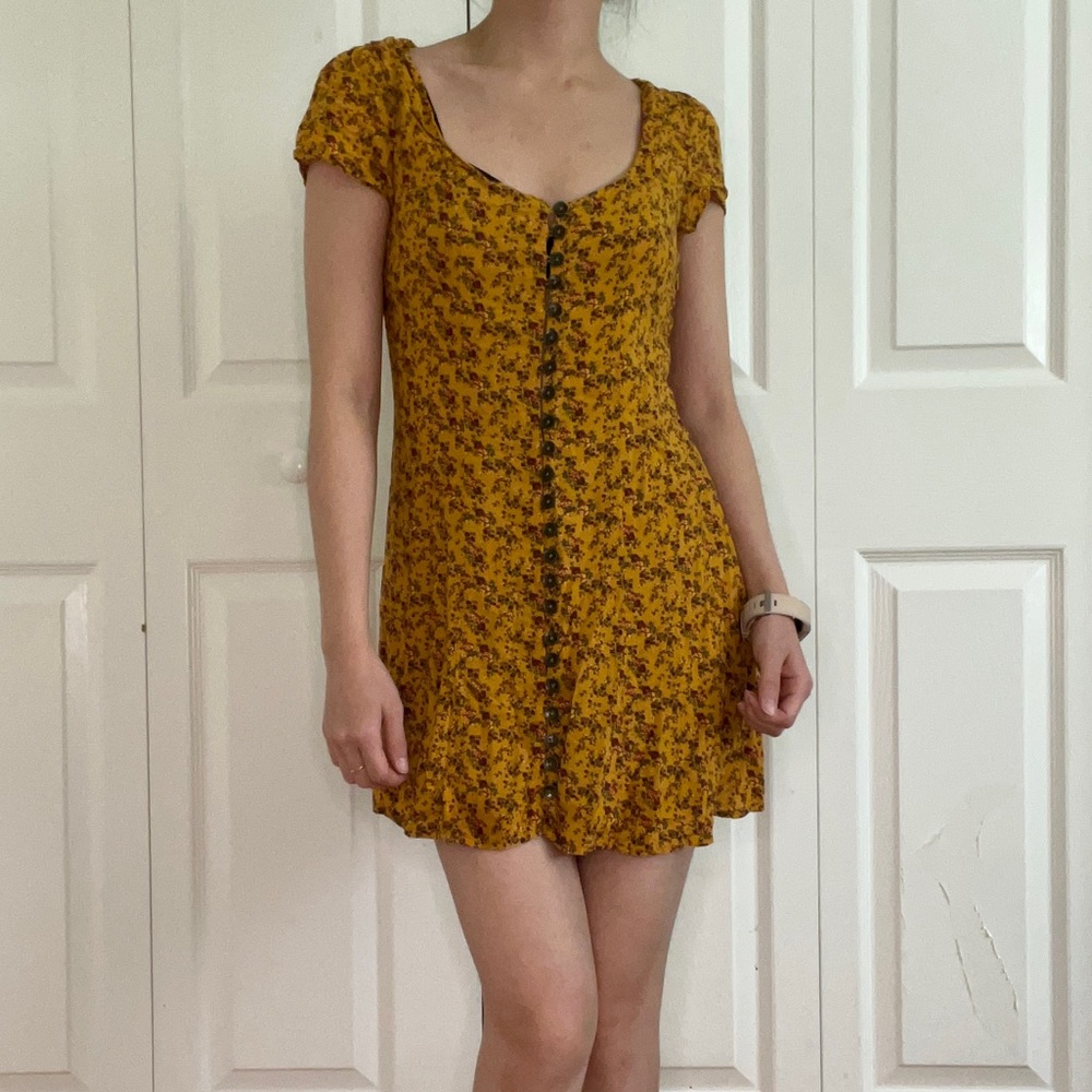 Mustard yellow floral dress with corset tie detailing on back